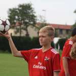 Pobega Tommaso enters the Vittorio Veneto soccer field during the AC Milan Junior Camp