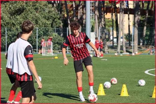 Boys play on the football soccer field during the AC Milan Academy Junior Camp in Lignano Sabbiadoro