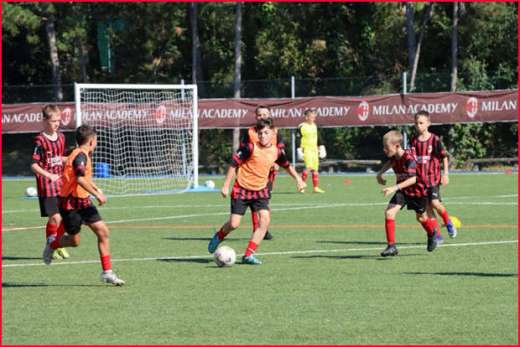 Children play on the football soccer field during the AC Milan Academy Junior Camp in Lignano Sabbiadoro